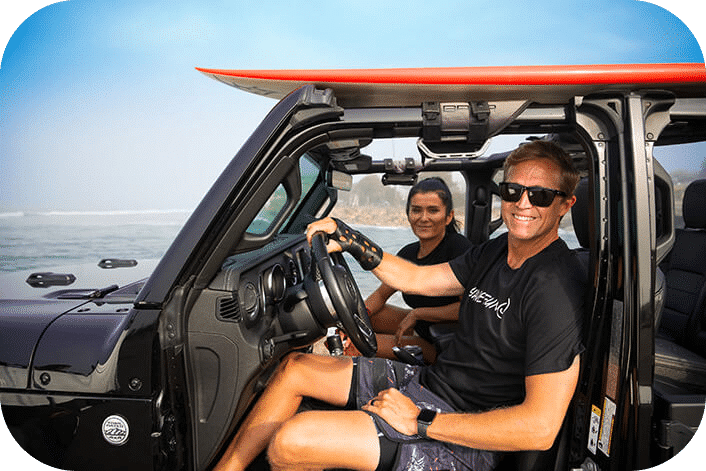 Man wearing a 3D printed cast on his wrist driving a car